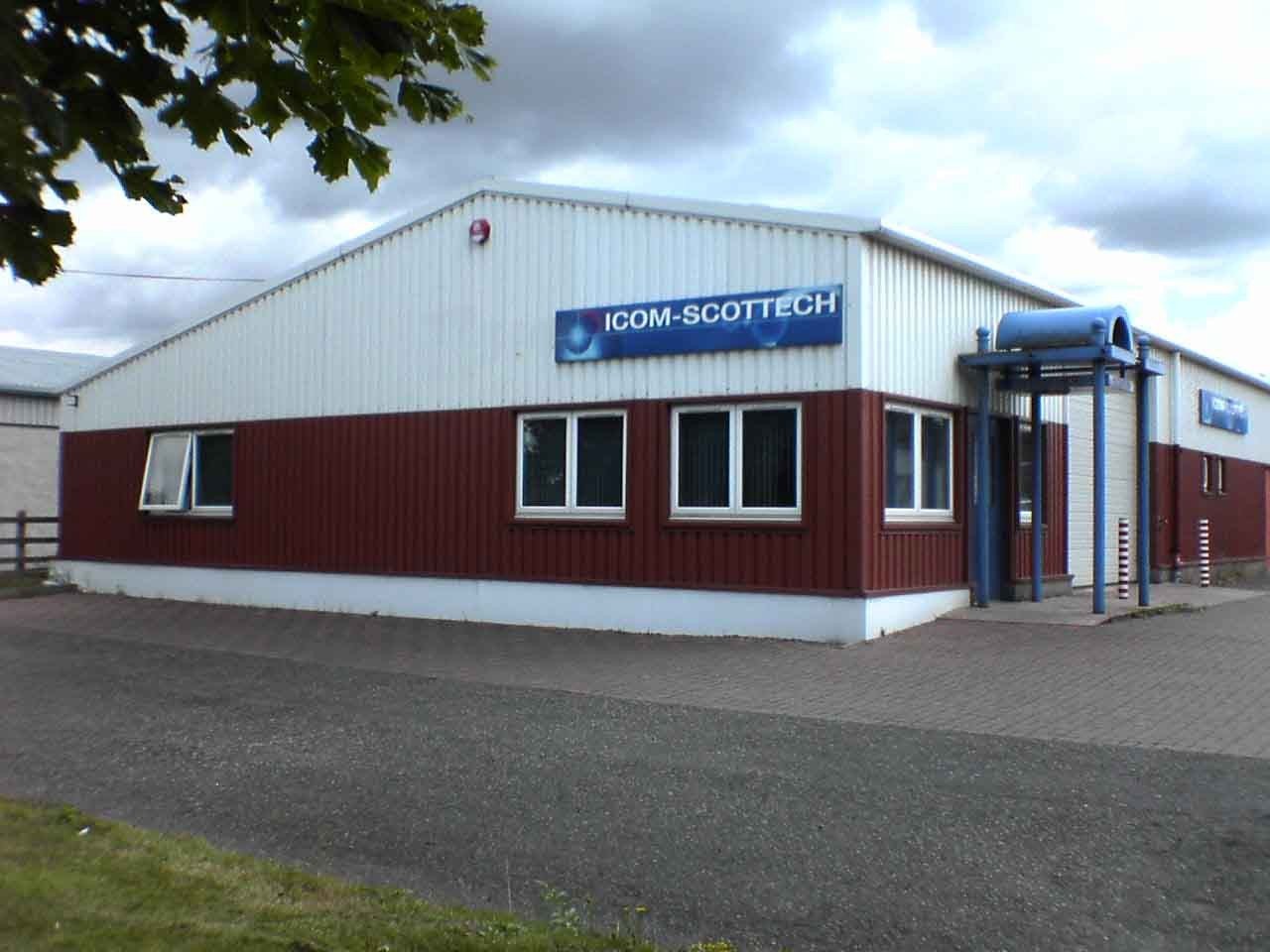 Icom-Scottech company history photo showing the facility and production activity