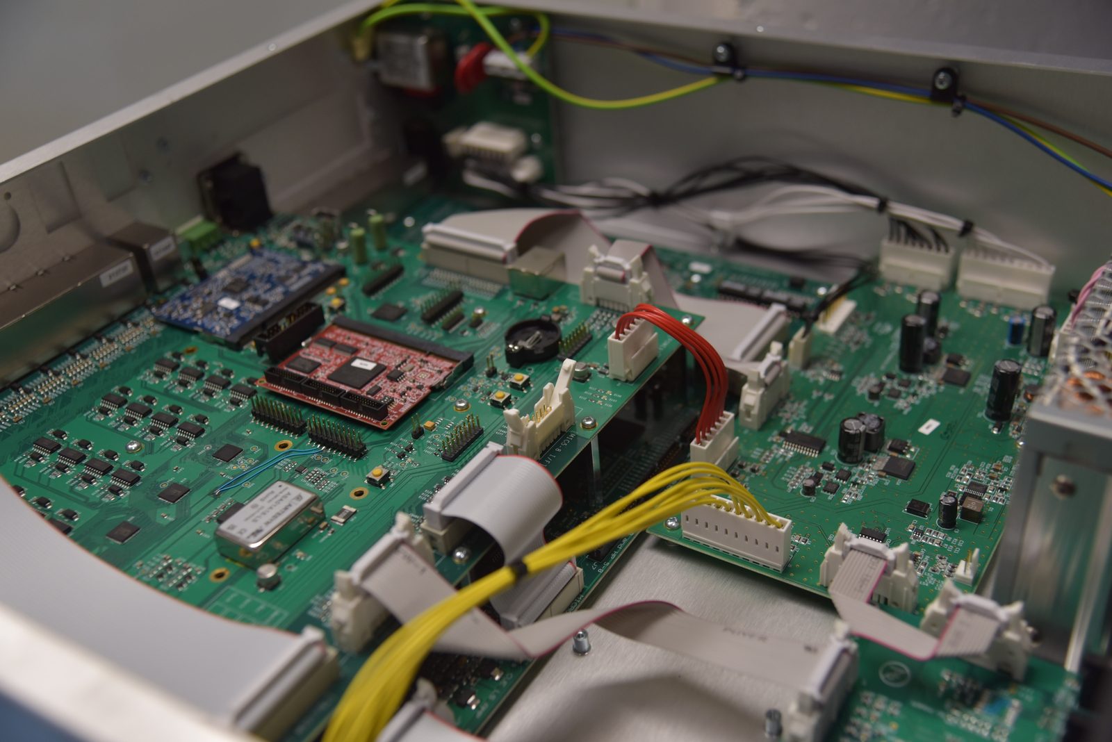 Fully integrated electronics assemblies inside a finished equipment enclosure